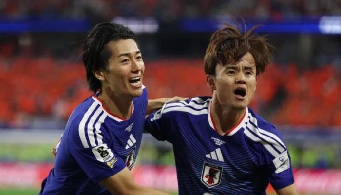 Japan stroll to victory over Tunisia in World Cup's 1,000th game