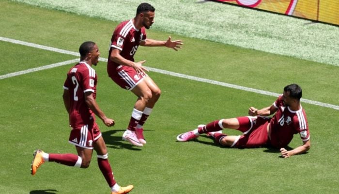 Qatar earn first ever World Cup point with late goal