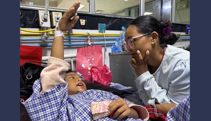 Mother reunited with 8-year-old who climbed trees to survive Nepal floods