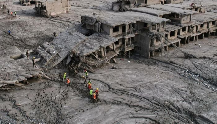Rescuers dig into tunnel as missing toll from Nepal, China flood nears 3,000