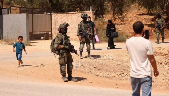 Palestinians told to leave homes in village where Israeli settlers besieged houses