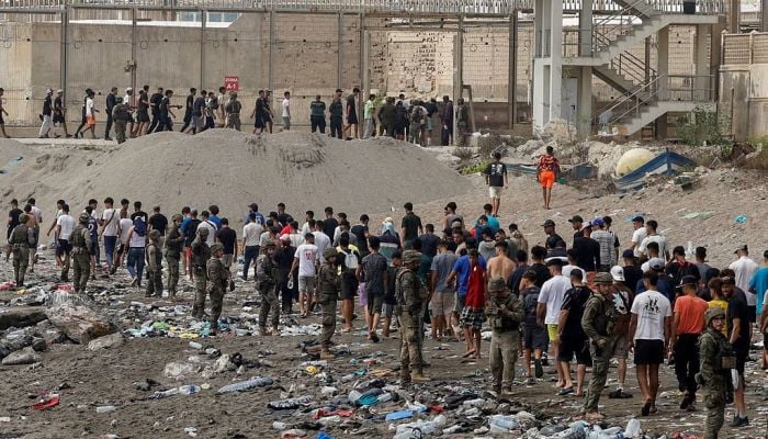 Spain says migrants are returning from Ceuta after 57 die in border rush